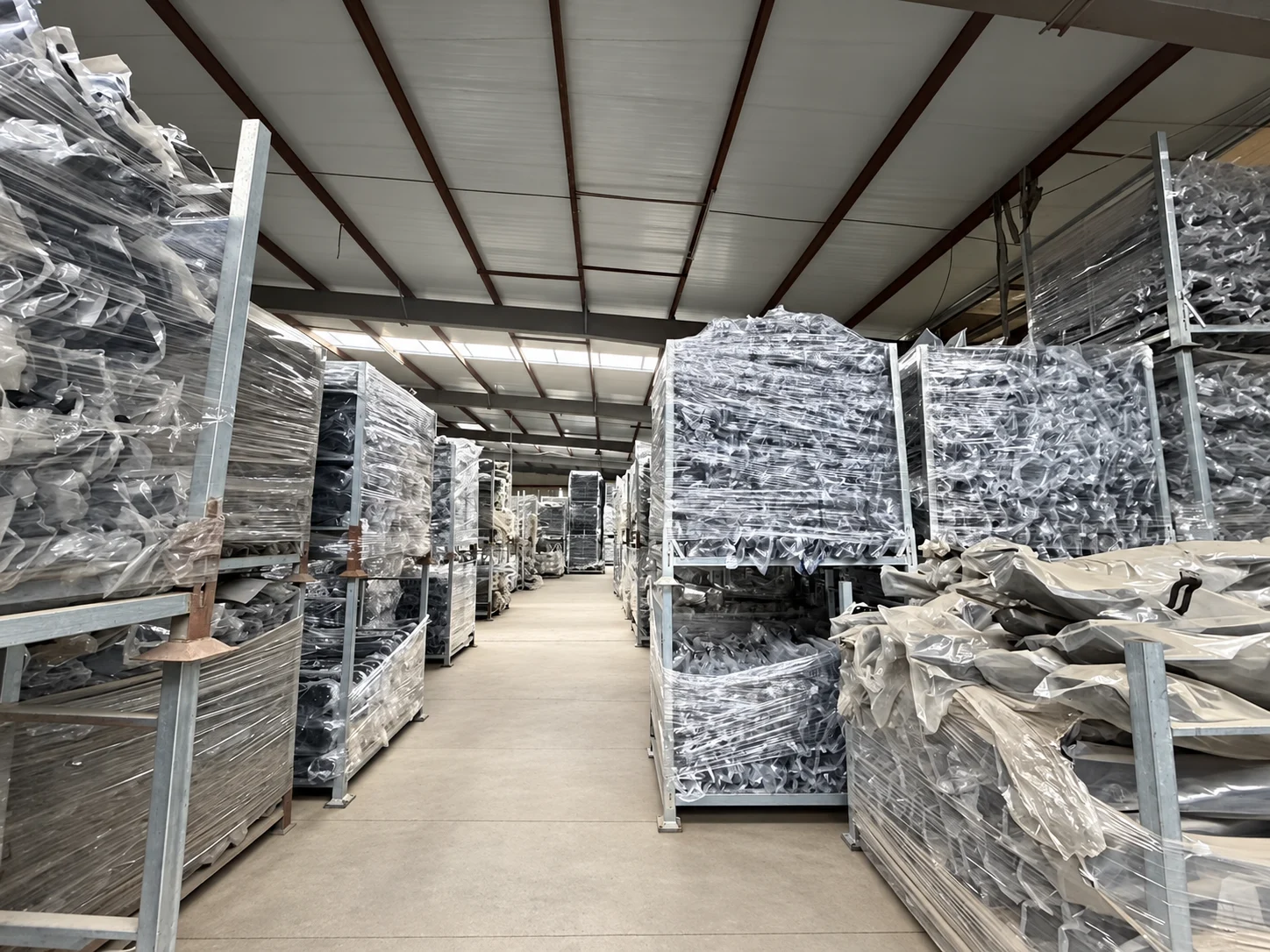Aisle between racks of wrapped auto parts